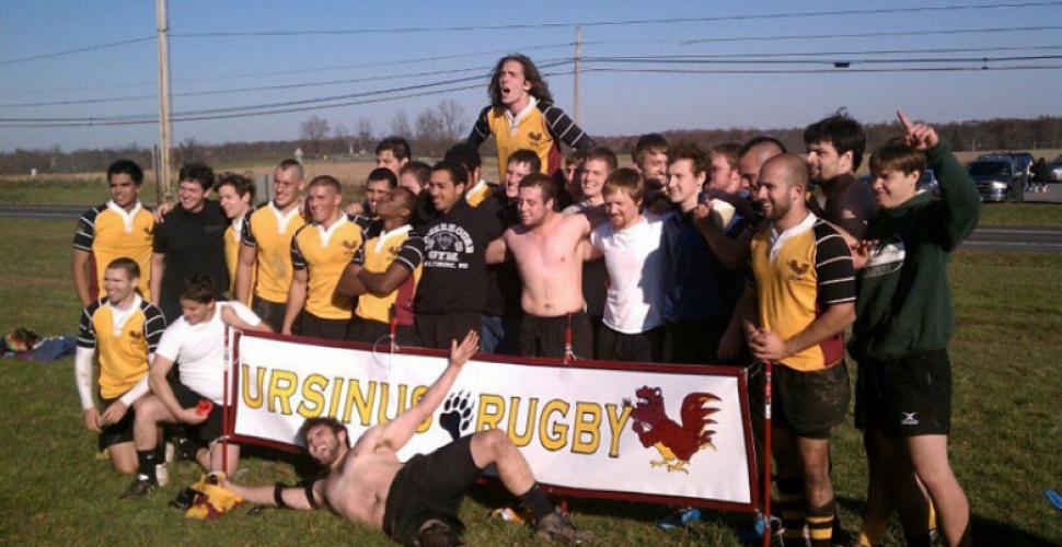 Ursinus College Rugby team with banner