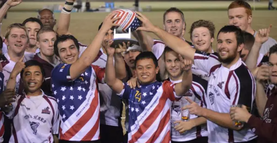 University of Massachusetts team celebrates after victory at URugby Bowl Series
